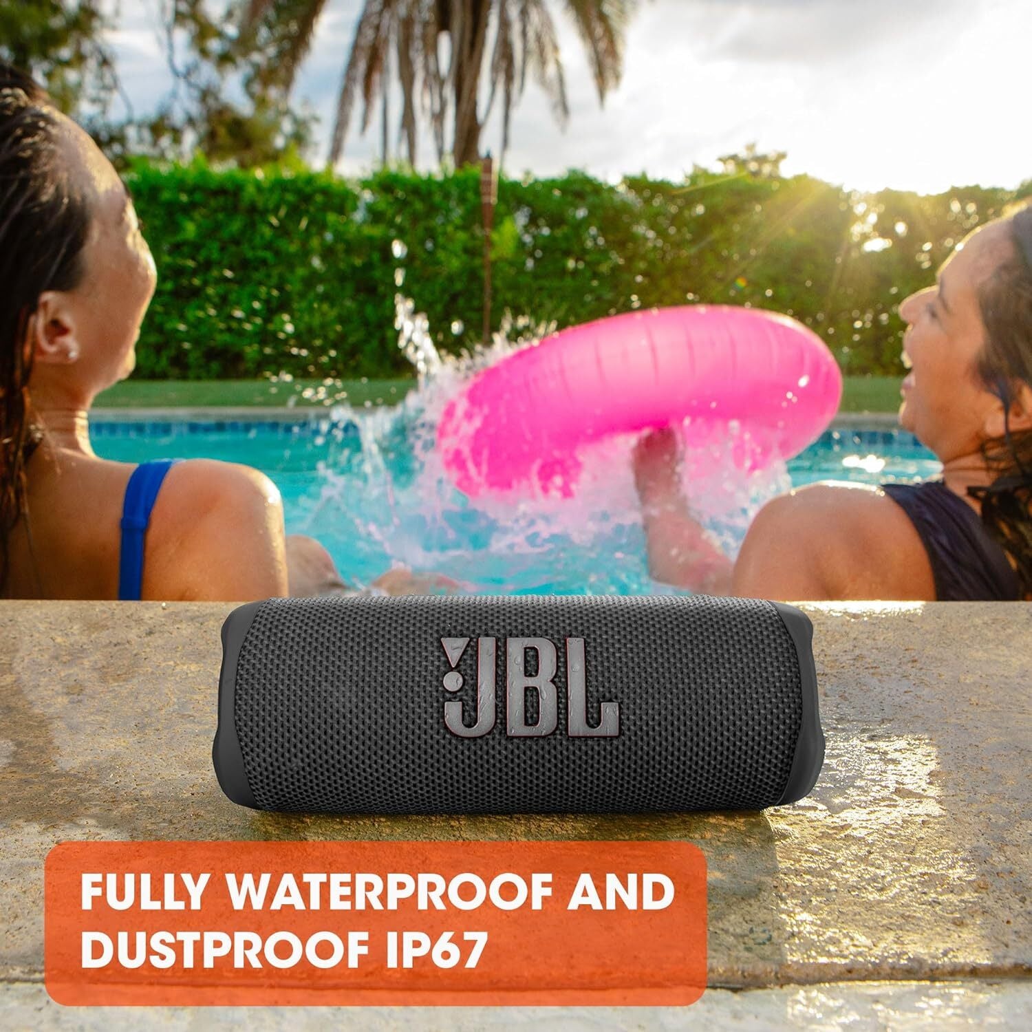 JBL Flip 6 speaker playing music at a beach party