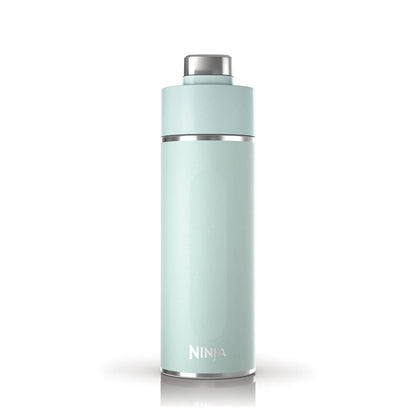 Travel flask in backpack side pocket on outdoor adventure